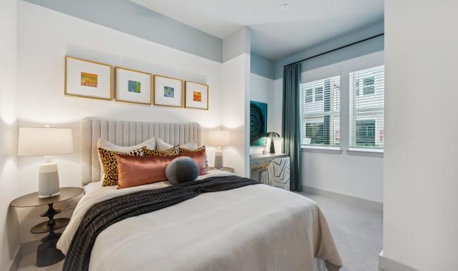 a bedroom with a bed and a table