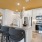 a kitchen with a bar stool and a table