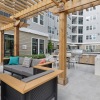 a courtyard area with chairs and a table