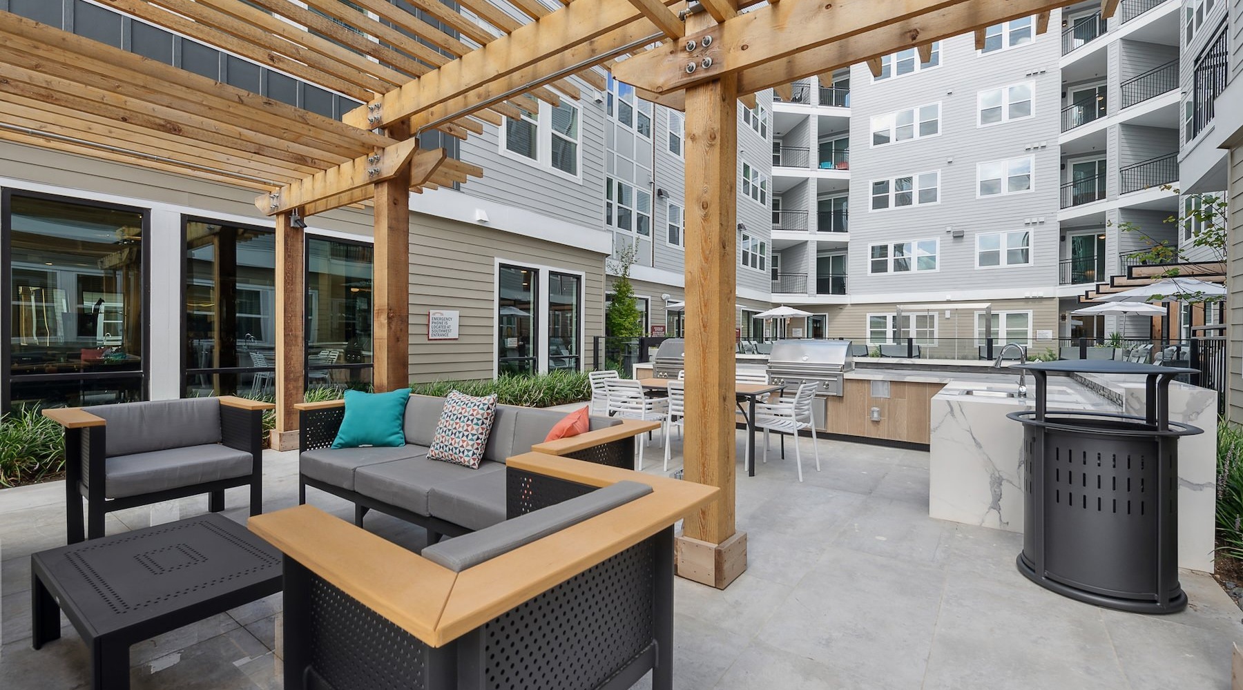 a courtyard area with chairs and a table