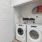 a white laundry room with a washer and dryer