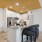 a kitchen with a large island and chairs