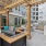 a patio with a wood roof and a couch and chairs and a table