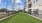 a green lawn next to a building