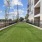a green lawn next to a building